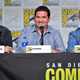 The creators of Cobra Kai, conveniently identified by placards on a 2019 Comic-Con panel.